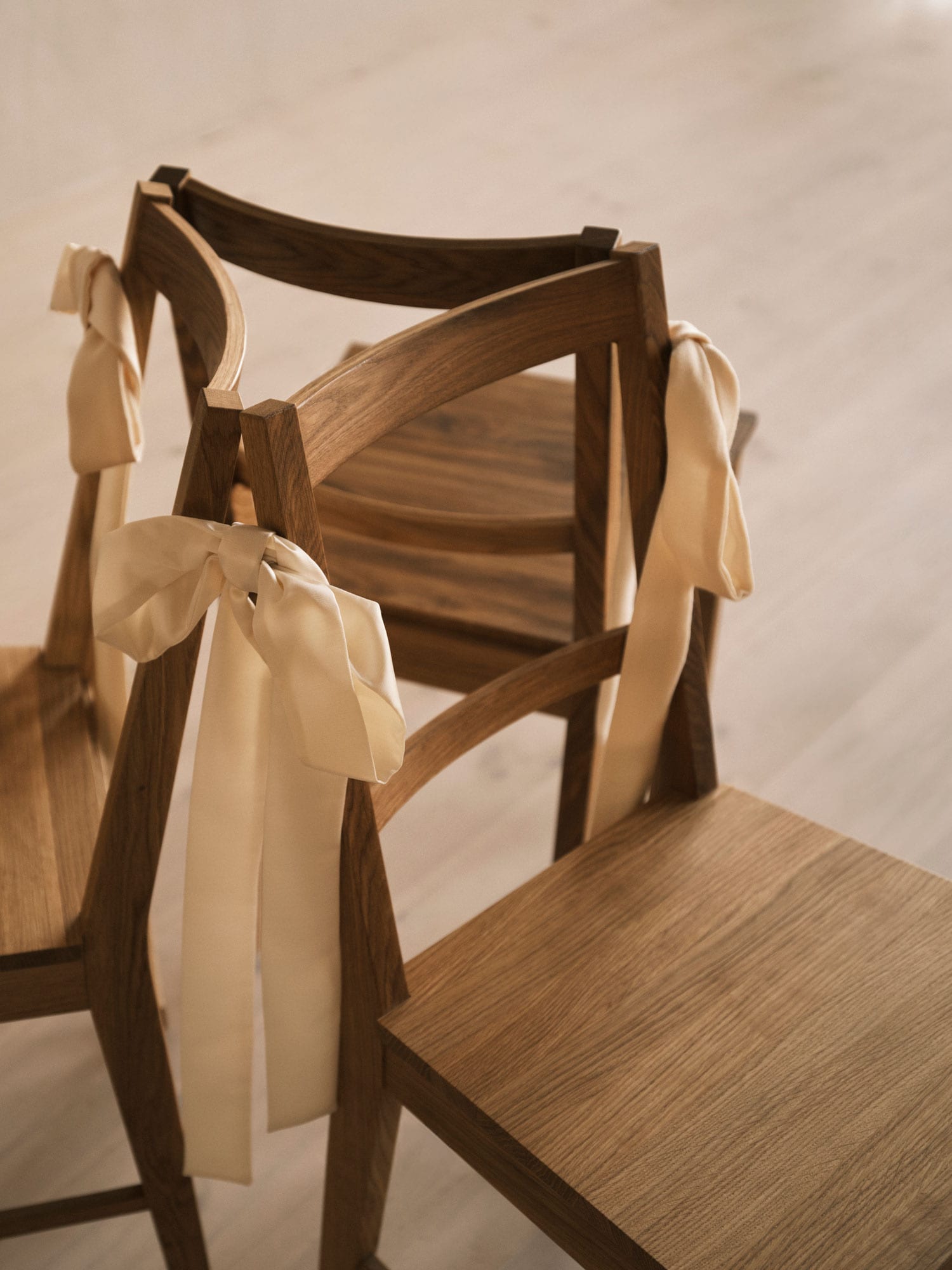 three chairs in a circle with rosettes