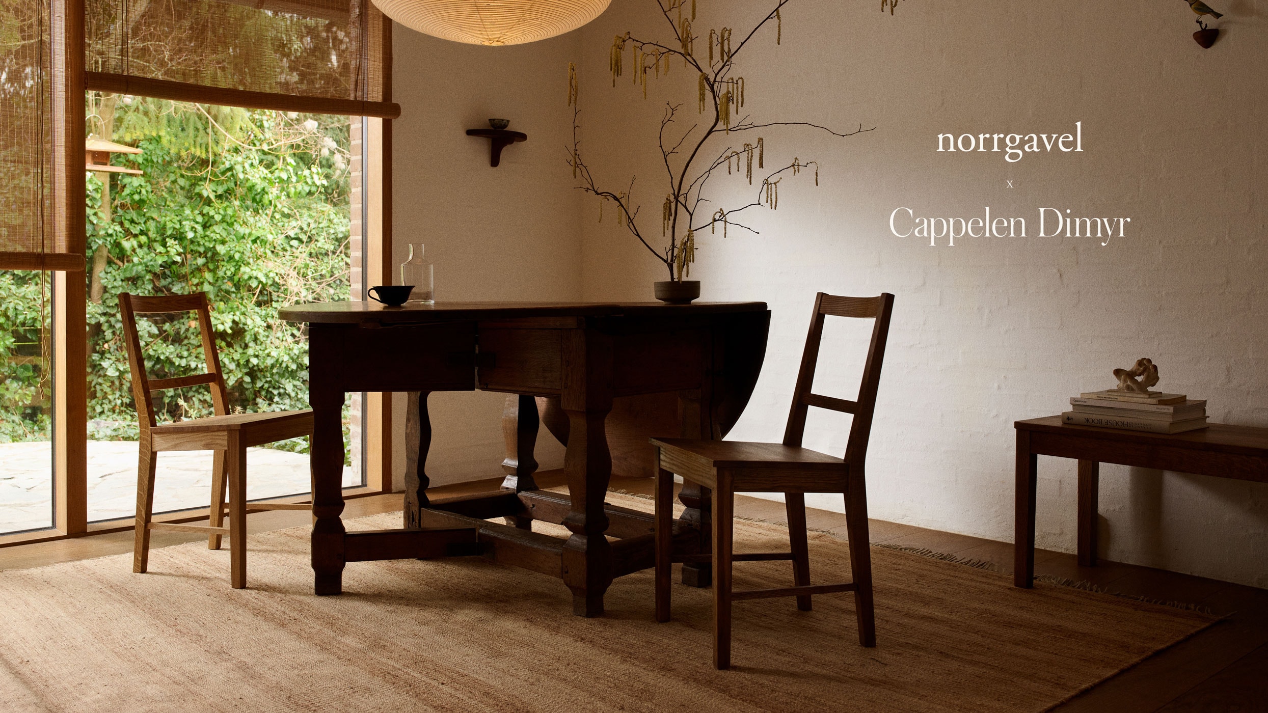 hemp rug under a wooden table in front of a large glass partition