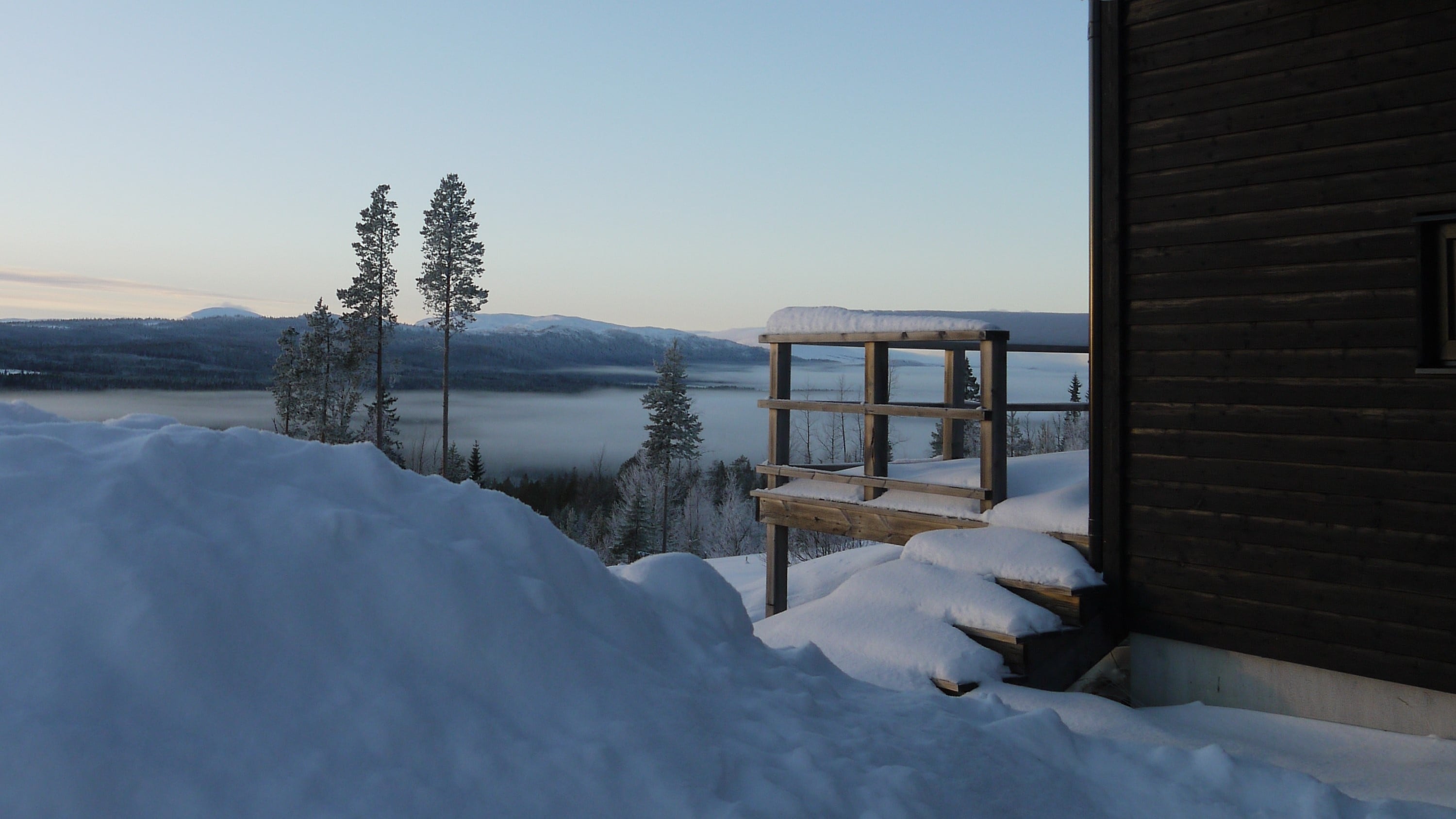 mountain cabin in winter landscape